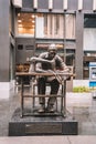 Statue of man with sewing machine known as the Ã¢â¬ÅGarment Worker